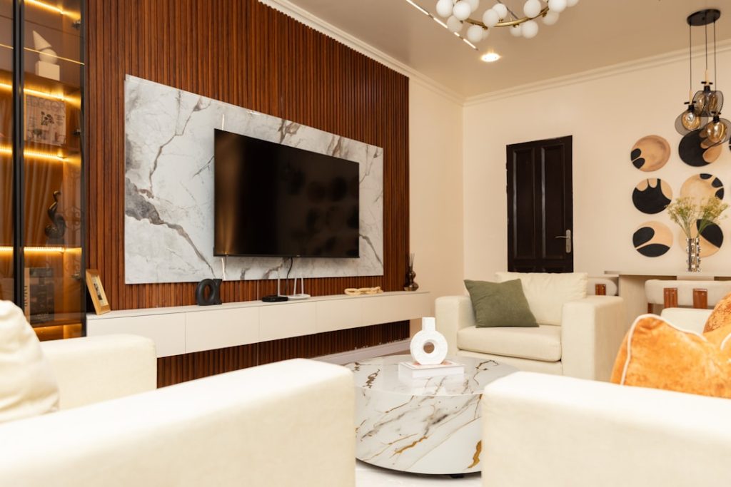 Modern living room with a wall-mounted TV and media area